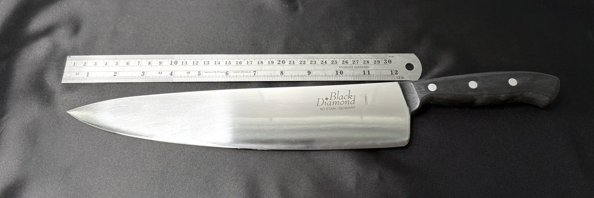Chef’s knife with stainless blade, black riveted handle, back ruler-style markings