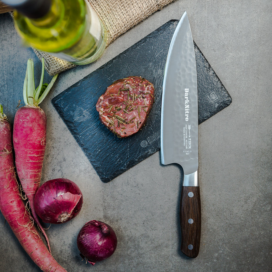 Chef knife with DarkNitro textured blade and oak handle, side view