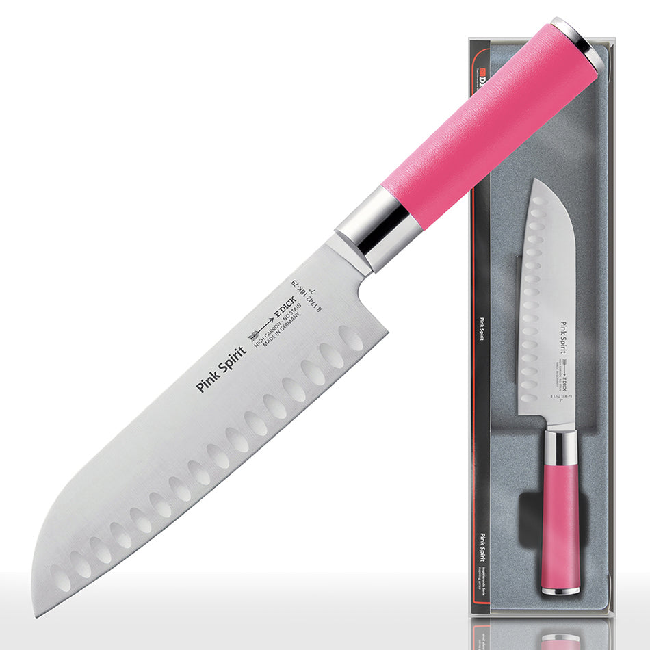 Pink-handled 7-inch santoku knife with scalloped edge on a cutting-board display