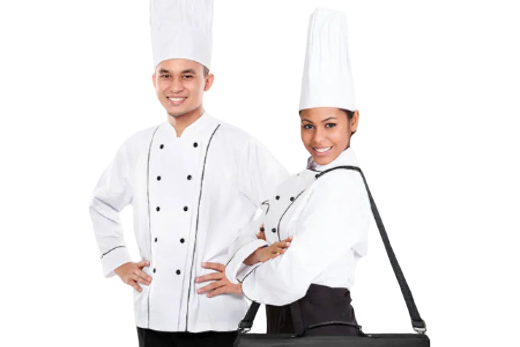 A man and a woman in white chef uniforms with tall hats pose next to a black Cookip insulated carrying bag with a shoulder strap, on a white background.