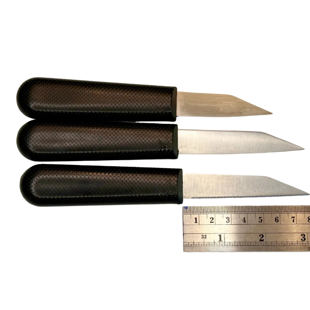 Three paring knives with black textured handles and stainless blades, shown with ruler