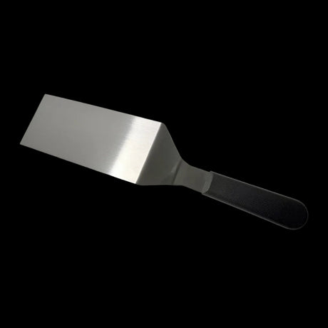 Hamburger turner with wide stainless steel blade and dark textured handle
