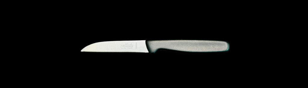 Knife with a black handle on a gray background
