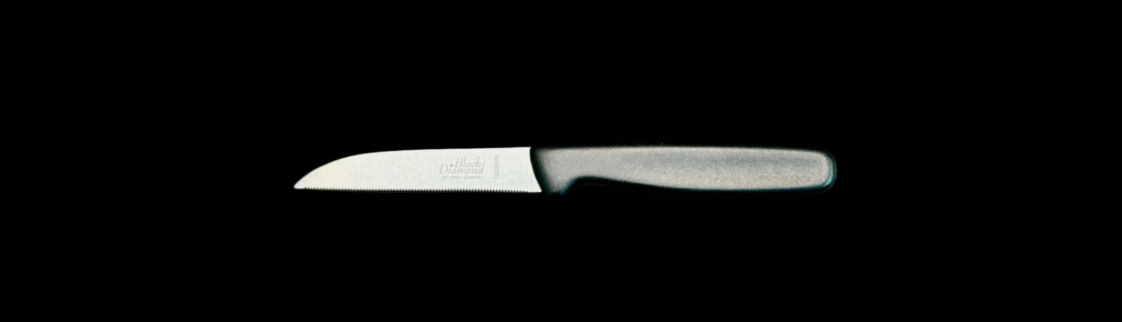 Knife with a black handle on a gray background