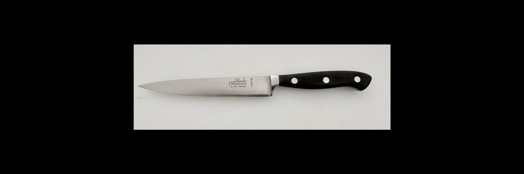 Knife with a black handle on a white background