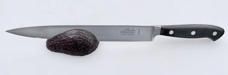 Kitchen slicer knife with stainless blade and black handle with white rivets