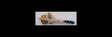 Kitchen slicer knife with black handle and stainless blade, next to sliced food