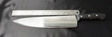 Chef’s knife with stainless blade, black riveted handle, back ruler-style markings