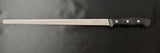 Long carving knife with black handle and 4-rivet grip, steel blade