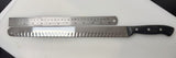 Serrated carving slicer knife with steel blade, black handle, and ruler-style markings