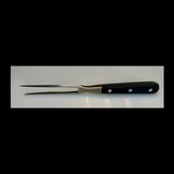 Stainless steel carving fork with black handle on a white background