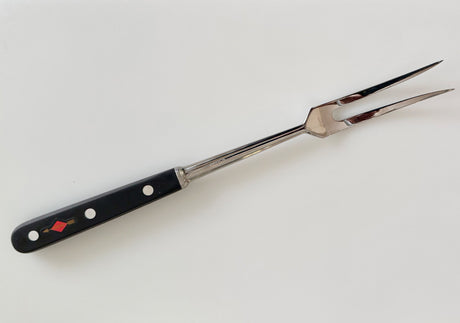 Forged carving fork with black handle, riveted grip, and two sharp carving tines