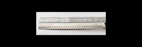 Carving knife blade with scalloped edge and shiny finish