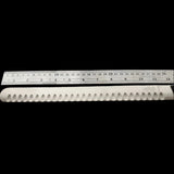 Knife blade with a ruler showing measurements on a white background