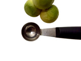 Double-sided melon baller with stainless steel scoop and black handle, engraved ends