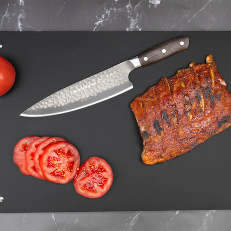 Chef knife with stainless, hammered-look blade and dark wood handle