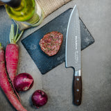 Chef knife with DarkNitro textured blade and oak handle, side view