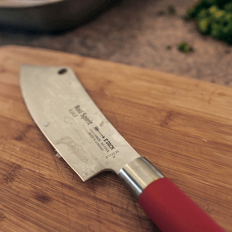 F.Dick Red Spirit AJAX chef knife, silver blade and red handle on wood
