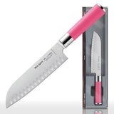 Pink-handled 7-inch santoku knife with scalloped edge on a cutting-board display