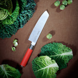 F.Dick Usuba knife with red handle and straight white blade on cutting board