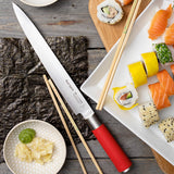 Sushi knife with long white blade and red handle, with chopsticks and sushi nearby
