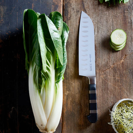 F.Dick Santoku kitchen knife with black handle and hollow-ground blade