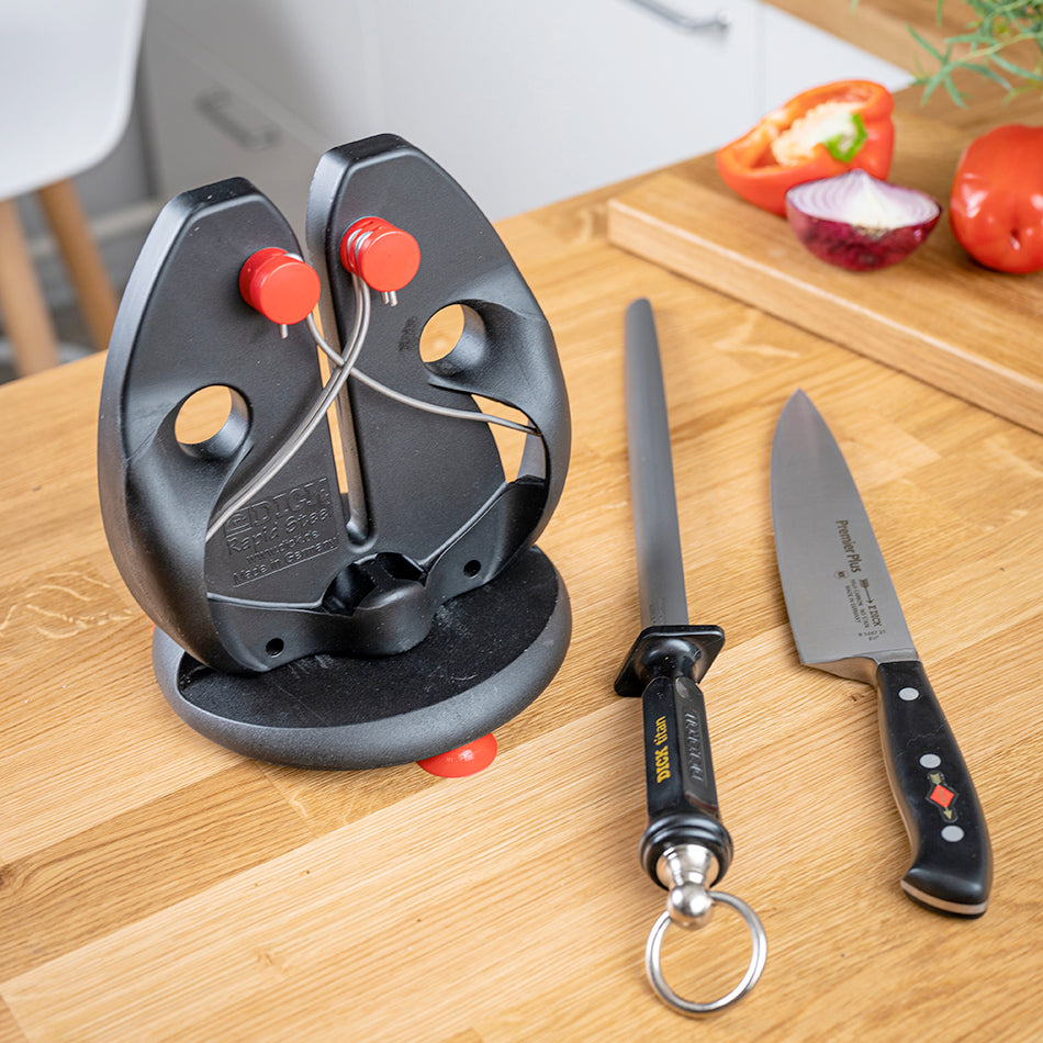 Knife sharpener stand with red knobs, plus two blades and key-ring tool