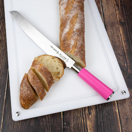 White cutting board with knife and sliced bread