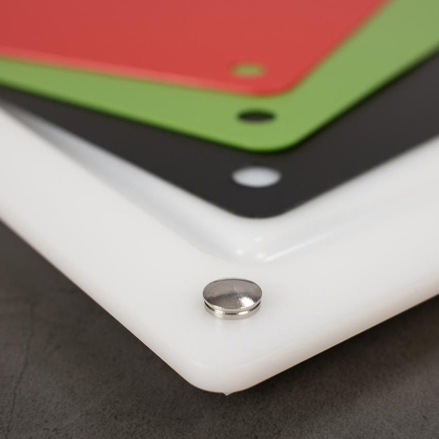White cutting board corner with stainless grommet