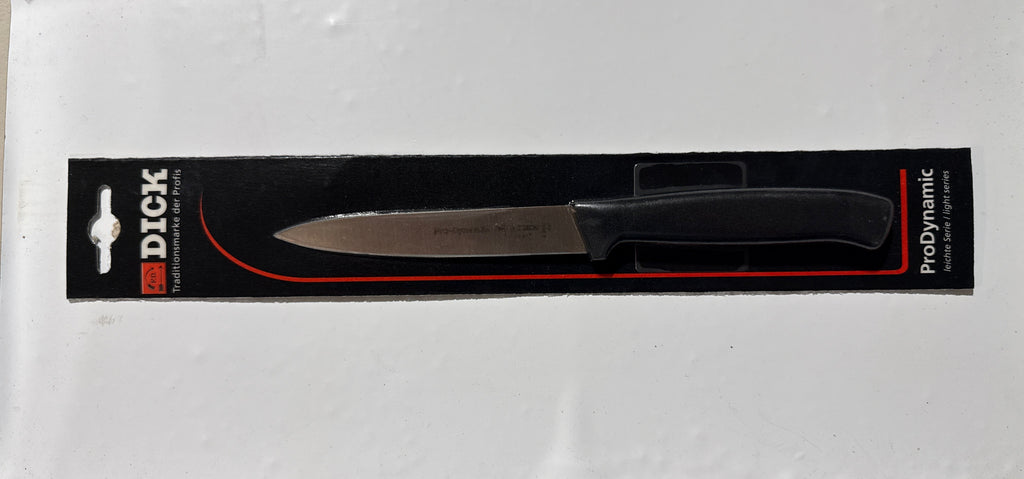A Dick ProDynamic utility knife in its original black retail packaging, displayed on a white sheet of paper.