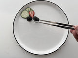 K2C 12-inch cooking tweezers/tongs holding strawberry, cucumber, and blackberry pieces