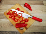 Chef knife with red handle and stainless blade on wooden cutting board