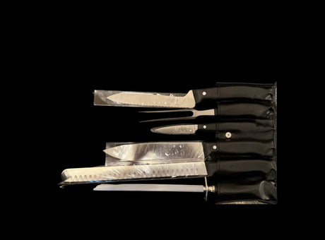 Knife set in storage sleeve, black handles with white dot accents