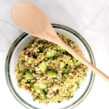 18 in wooden serving spoon with chopped salad on the spoon