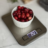 CookUP digital kitchen scale with LCD display showing weight, stainless platform