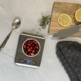 CookUP digital kitchen scale with LCD display and buttons, set on countertop